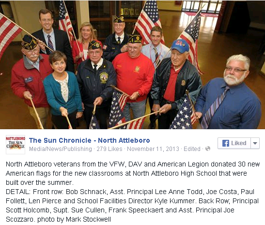 North Attleboro veterans from the VFW, DAV and American Legion donated 30 new American flags for the new classrooms at North Attleboro High School that were built over the summer. DETAIL: Front row: Bob Schnack, Asst. Principal Lee Anne Todd, Joe Costa, Paul Follett, Len Pierce and School Facilities Director Kyle Kummer. Back Row; Principal Scott Holcomb, Supt. Sue Cullen, Frank Speeckaert and Asst. Principal Joe Scozzaro. photo by Mark Stockwell